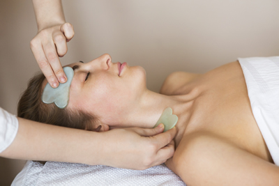 Gua Sha treatment using jade massage tool